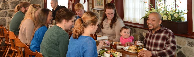 family talking and laughing at dinner