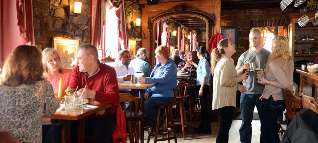 customers enjoying food and drinks at the restaurant and bar